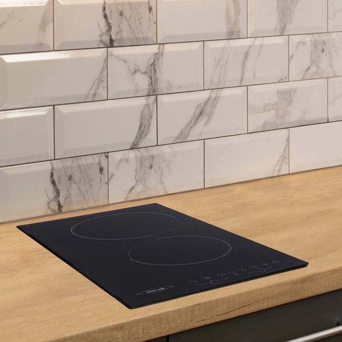 Estufa de empotrar vitrocerámica negra 22V Marca Haceb