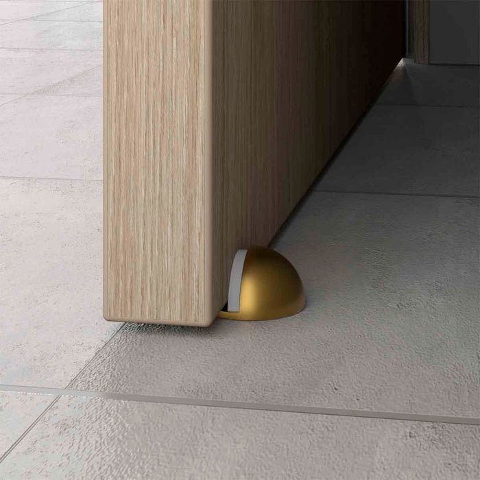 Tope para puerta media luna fijado al piso